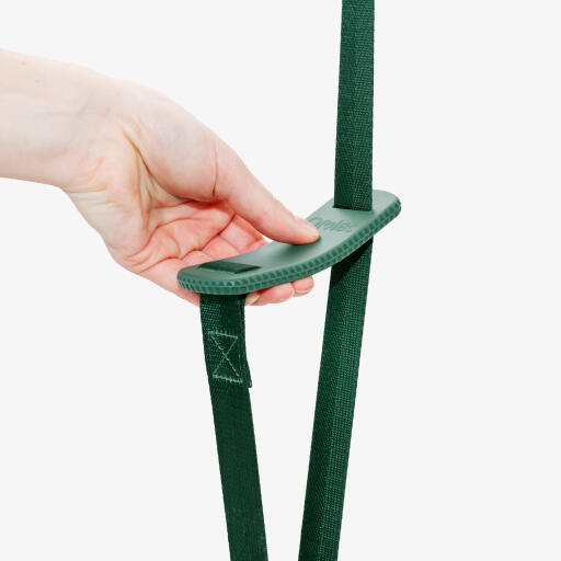 hand holding hangar for feeder or waterer