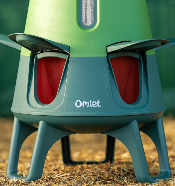 close up of omlet smart automatic chicken feeder legs