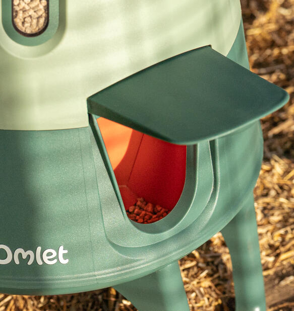 detail of omlet smart automatic chicken feeder feeding port